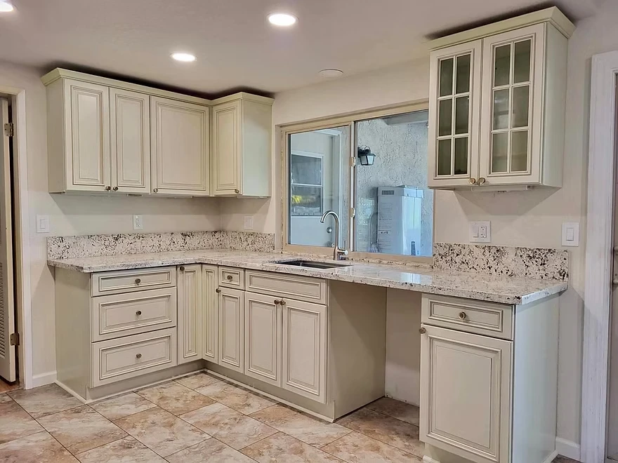 Kitchen Restoration, with traditional raised panel cabinets, granite countertops, waterpro