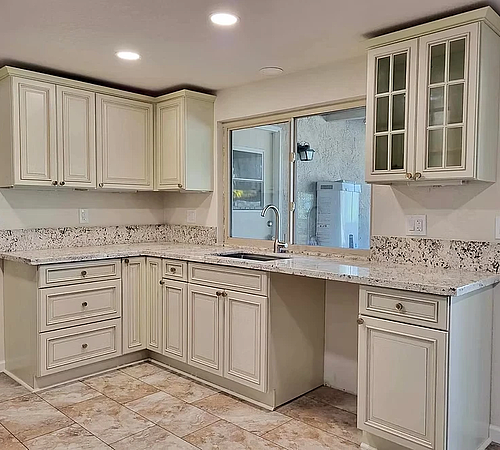 Kitchen Restoration, with traditional raised panel cabinets, granite countertops, waterpro