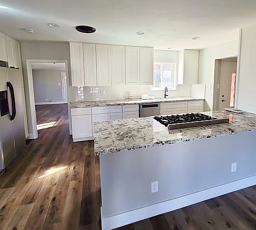 Kitchen Remodel. White shaker cabinets. Subway tile backsplash. Granite countertops. Luxury flooring.